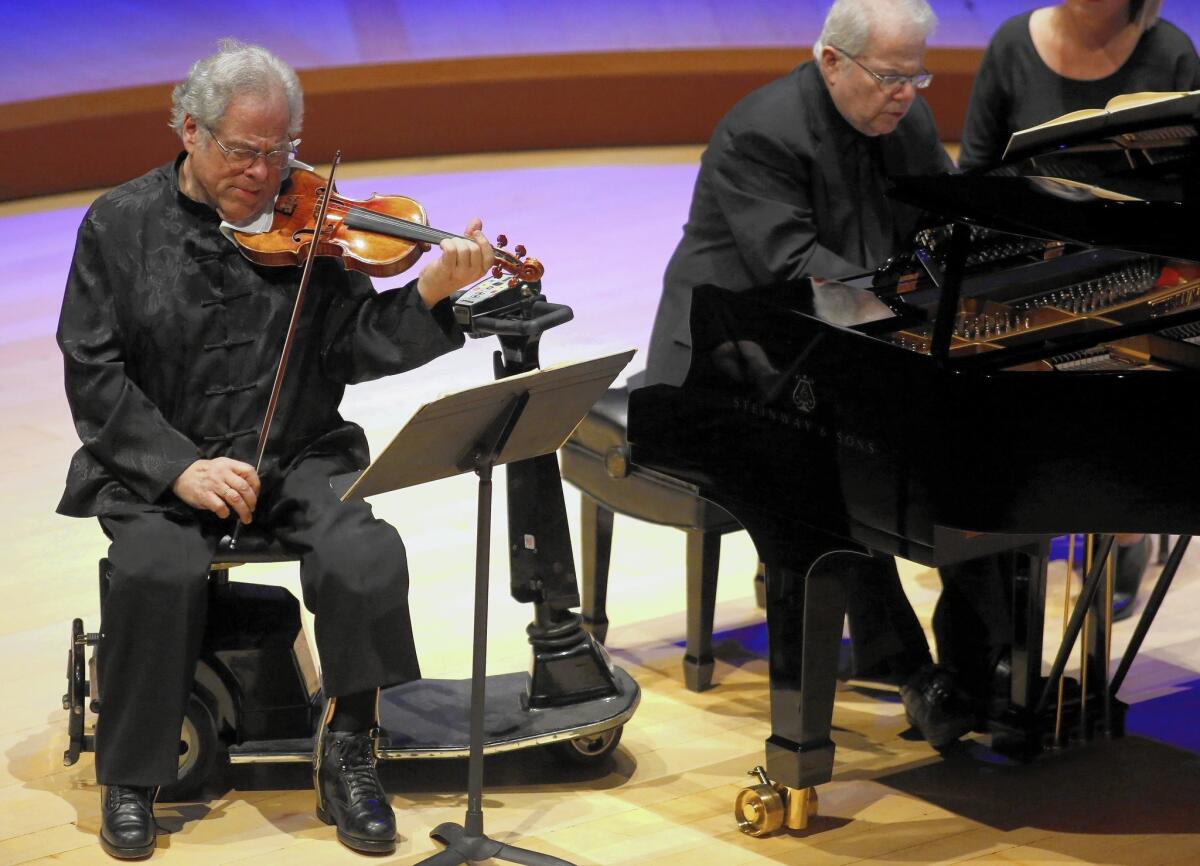 Itzhak Perlman, left, and Emmanuel Ax perform on Tuesday night at the Walt Disney Concert Hall.