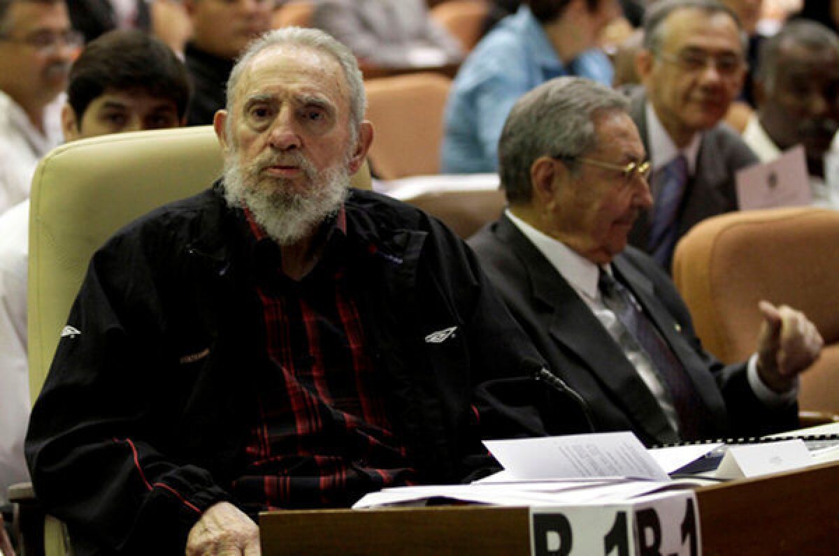 Former Cuban president Fidel Castro, left. sitting next to his brother and current president, Raul, as Cuba's new National Assembly meets February 24.
