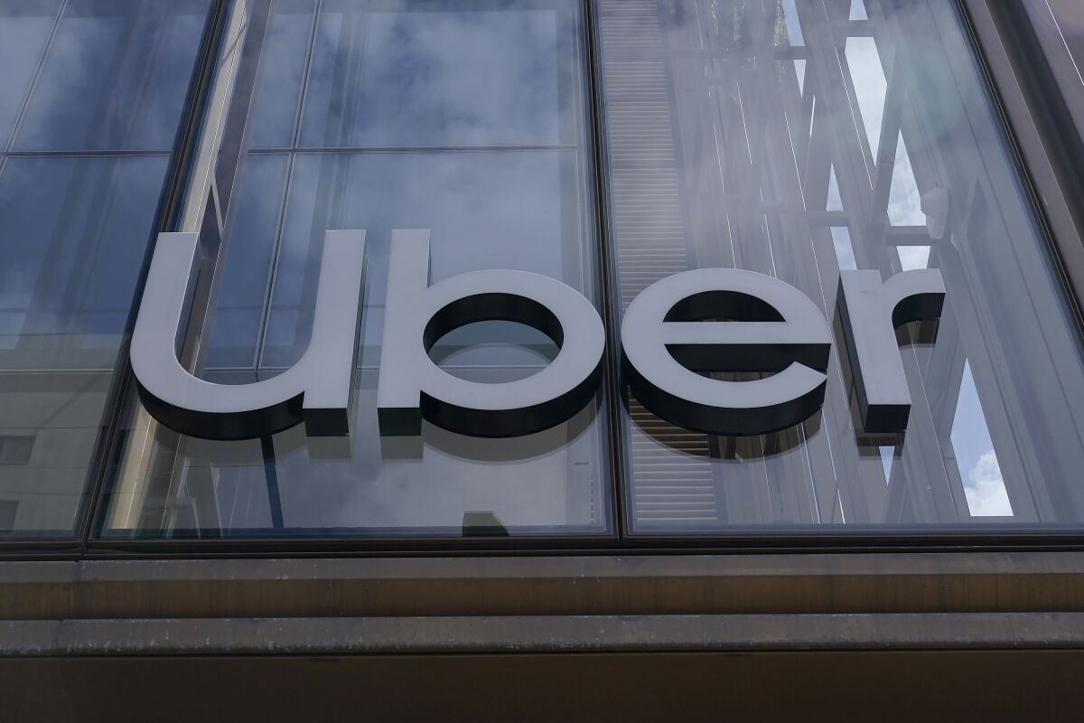 FILE - An Uber sign is displayed at the company's headquarters in San Francisco, Monday, Sept. 12, 2022. Joseph Sullivan, the former chief security officer for Uber, was convicted Wednesday, Oct. 5 of trying to cover up a 2016 data breach in which hackers accessed tens of millions of customer records from the ride-hailing service. (AP Photo/Jeff Chiu, File)