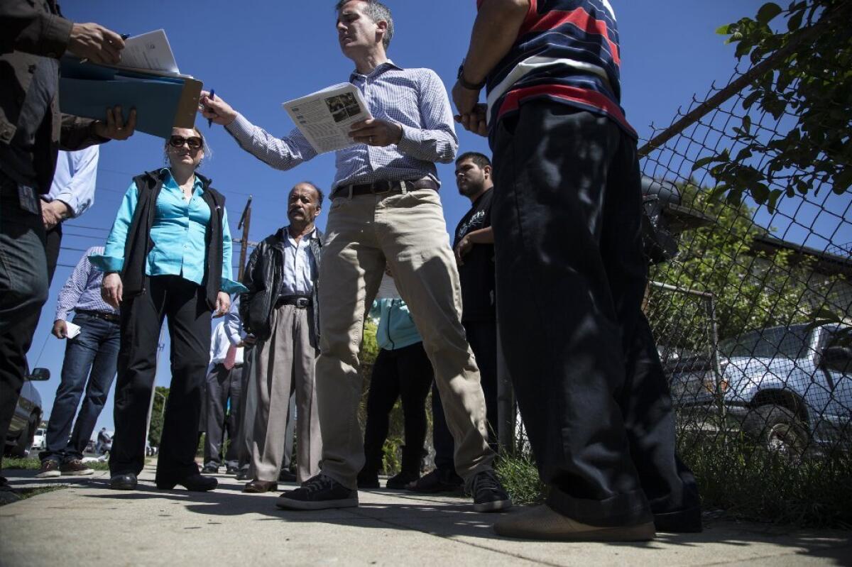 Mayor Eric Garcetti chats with residents in Boyle Heights on Saturday.