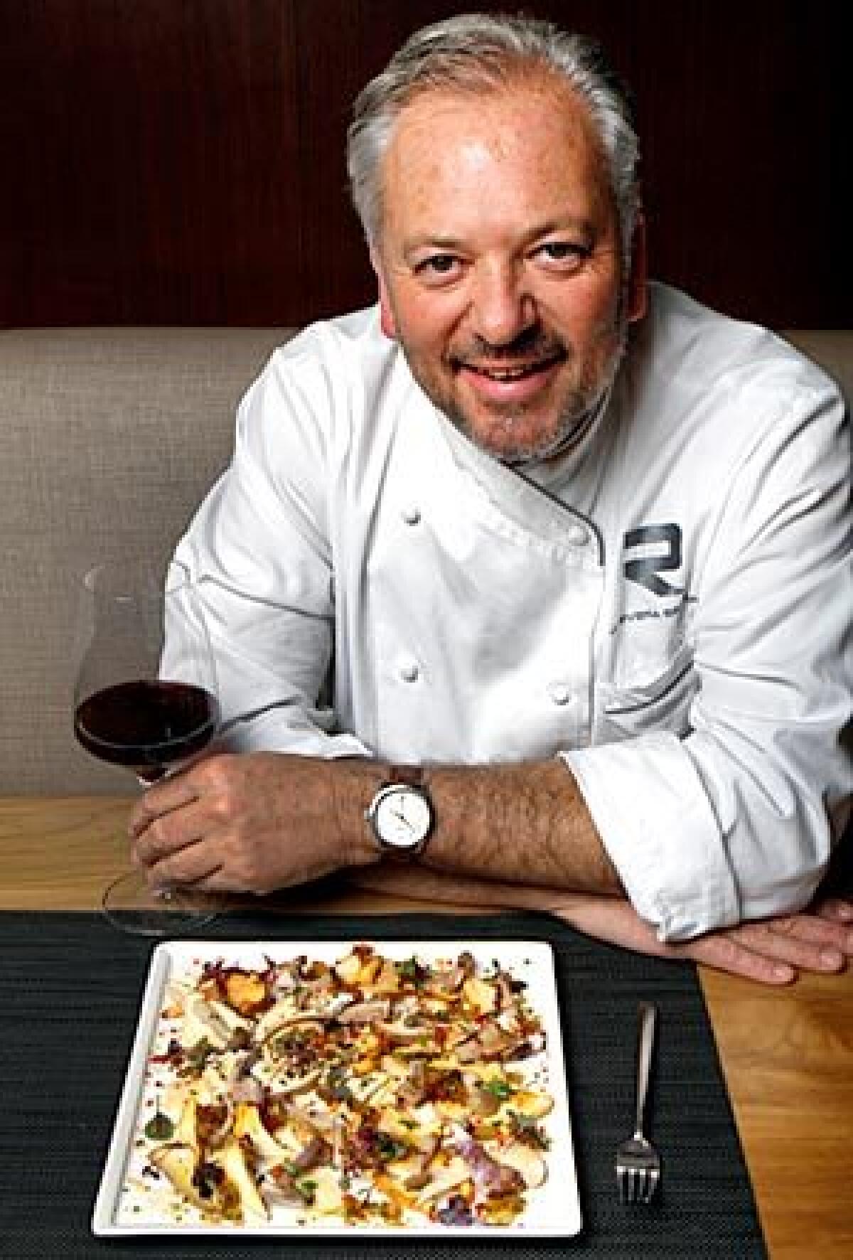 Rivera's John Sedlar, with a plate of mushroom carpaccio.