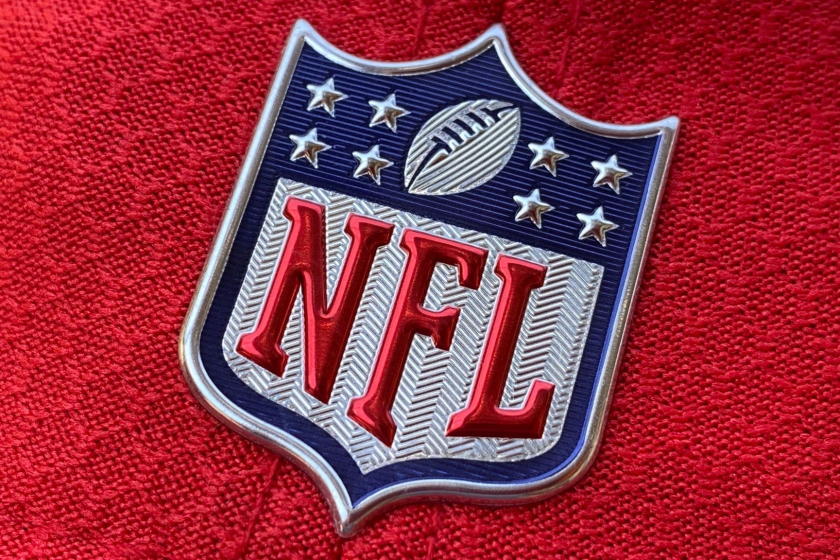 The official NFL logo is seen on the back of a hat.