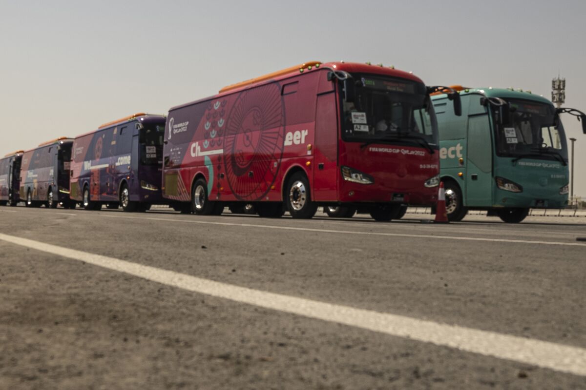 Buses are seen during a test run of massive bus fleet ahead of Qatar World Cup, in Doha, Qatar, Thursday, Sept. 22, 2022. Thani Al Zarraa, who is overseeing transport preparations, said some 4,000 buses will be used during the tournament, which around 700 will be electric. (AP Photo/ Lujain Jo)
