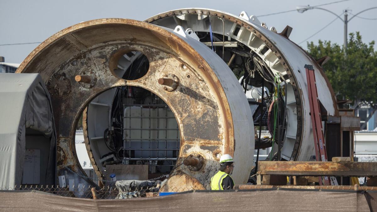Construction crews in Hawthorne work on the entrance to a tunnel across the street from SpaceX headquarters. On Tuesday, the Boring Co. will unveil the first leg in what founder Elon Musk envisions as a vast network of tunnels to ease traffic congestion in Southern California.