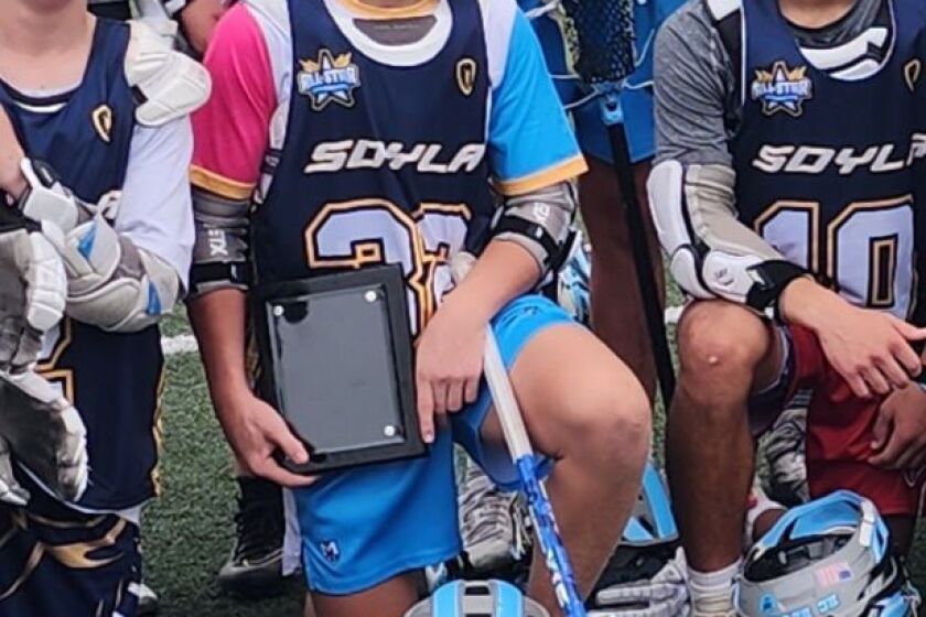 Harrison Jacobsen (center), the 2023 Player of the Year selected by San Diego Youth Lacrosse Association.