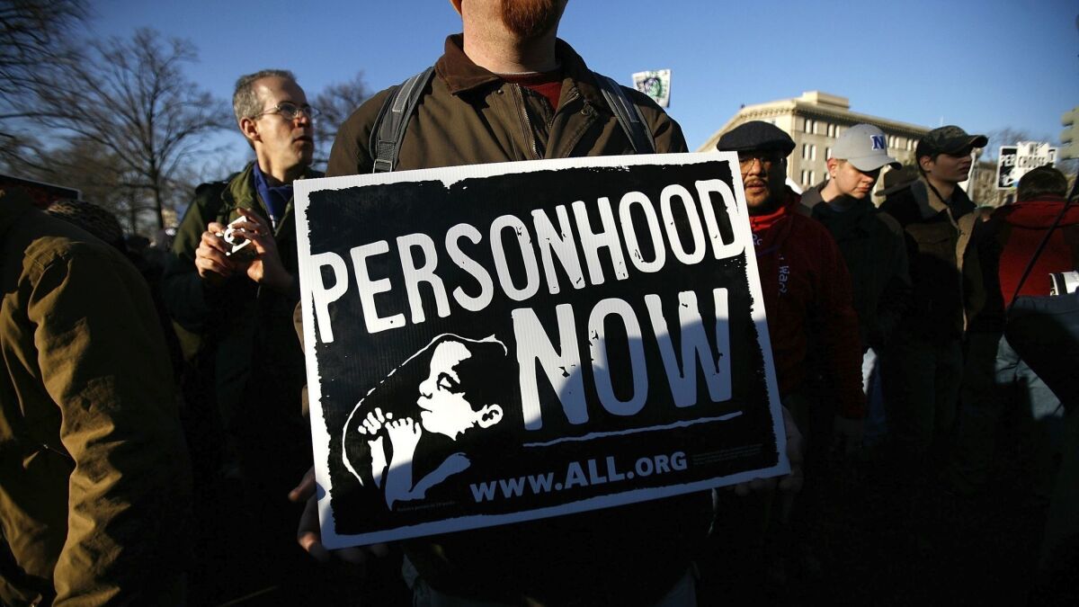 An antiabortion activist holds a sign as he participates in the annual March for Life event in Washington on Jan. 22, 2009.