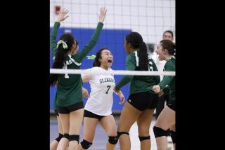 Glendale Adventist High School Cougars #7 Camille Pizarro, center, celebrates a point in the CIF Southern Section Division 9 girls volleyball championship game vs. Santa Clarita Christian School Cardinals, at Cerritos College in Norwalk on Friday, Nov. 10, 2017. The Cougars won the match and the championship 3-1.