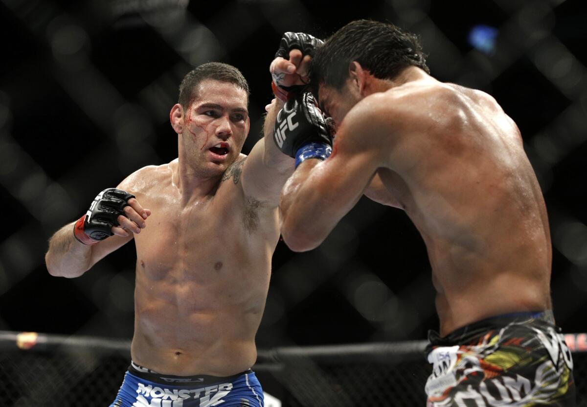 Chris Weidman, left, improved to 12-0 when he defeated Lyoto Machida by unanimous decision in a middleweight title bout July 5.