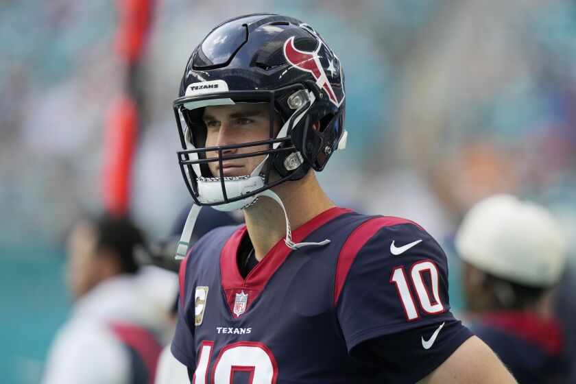 Houston Texans quarterback Davis Mills (10) stands on the sidelines during the second half of an NFL football game against the Miami Dolphins, Sunday, Nov. 27, 2022, in Miami Gardens, Fla. (AP Photo/Lynne Sladky)