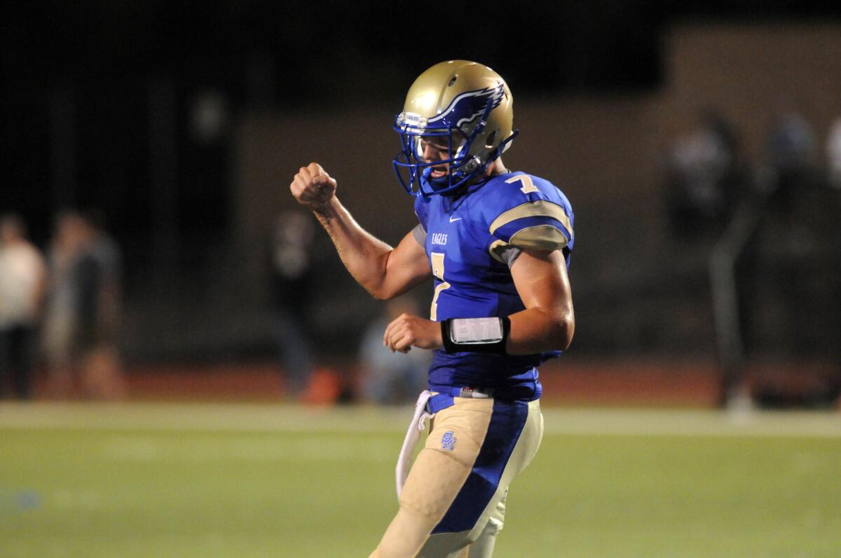 Santa Margarita quarterback K.J. Costello celebrates after throwing a touchdown pass against Trabuco Hills last season.