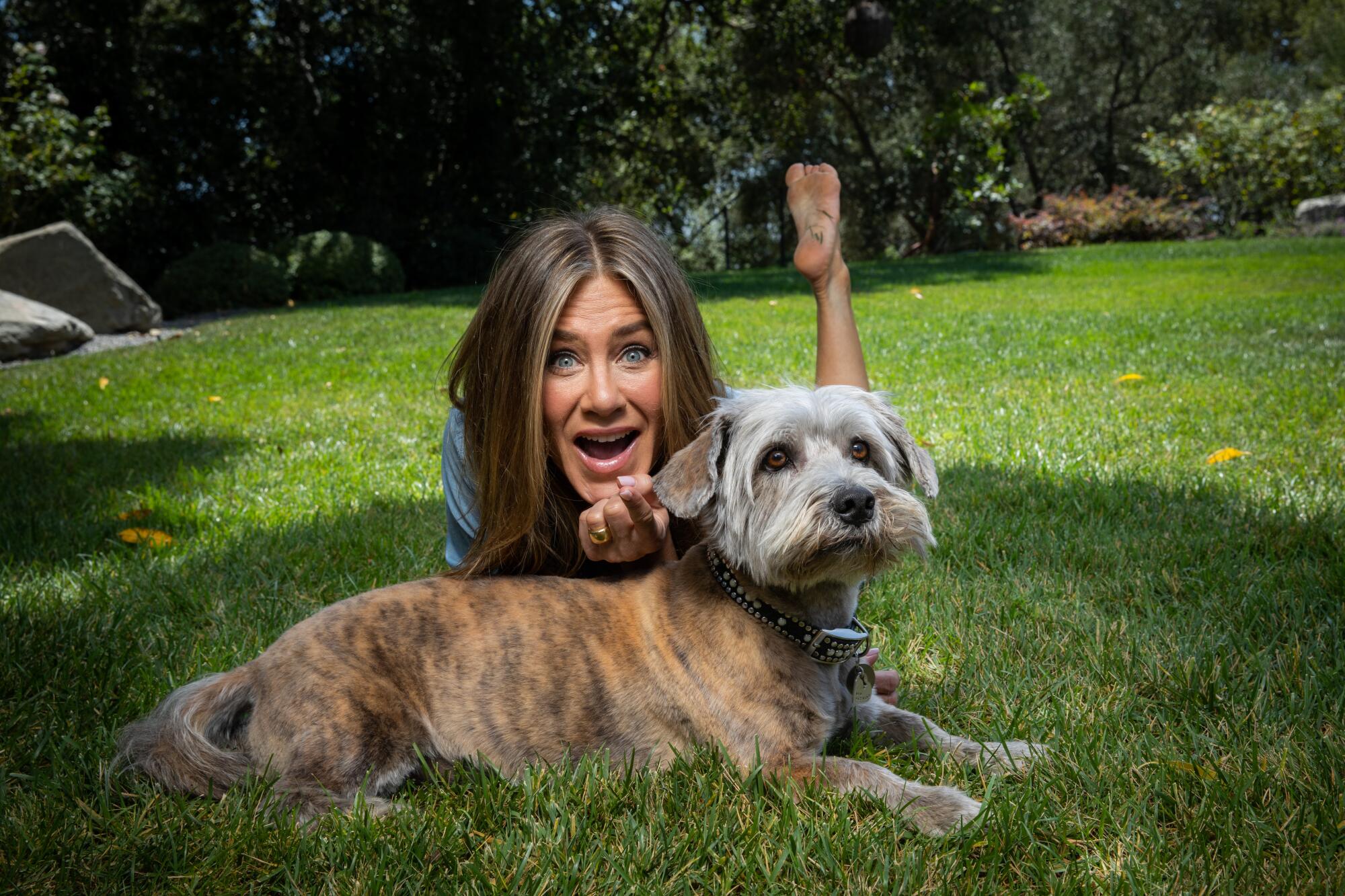 Actress Jennifer Aniston with her dog Clyde