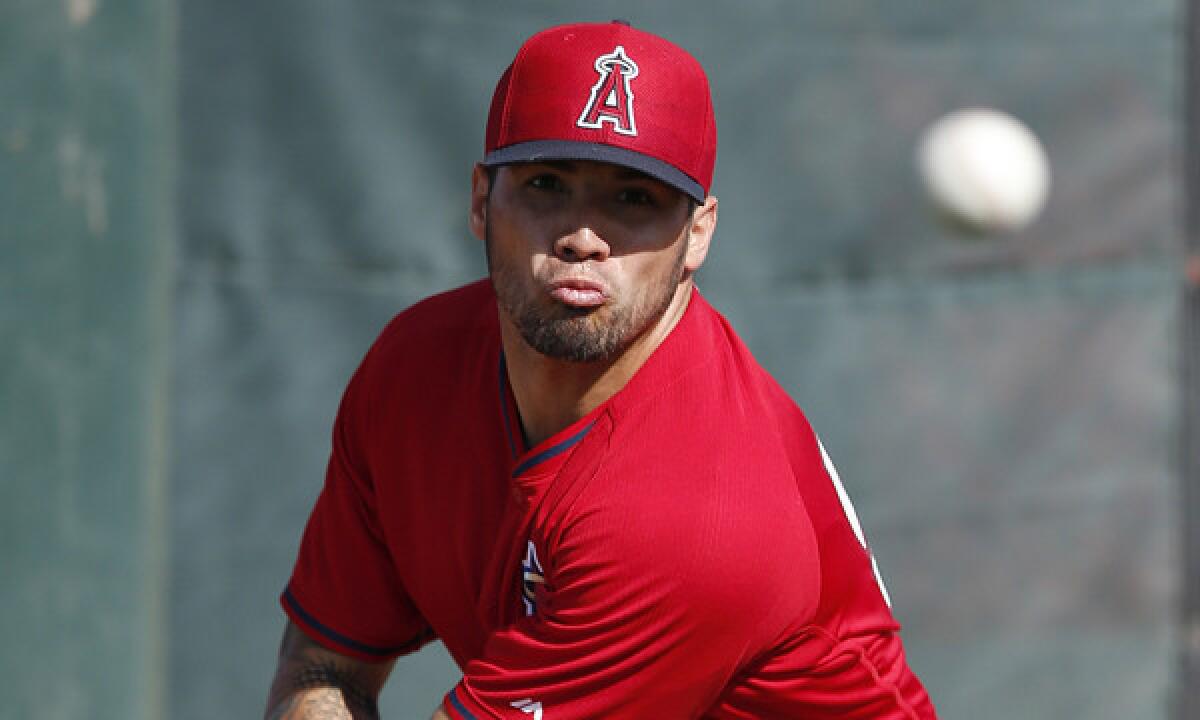 Angels starter Hector Santiago throws a pitch during a spring-training practice session in Tempe, Ariz., on Feb. 18.