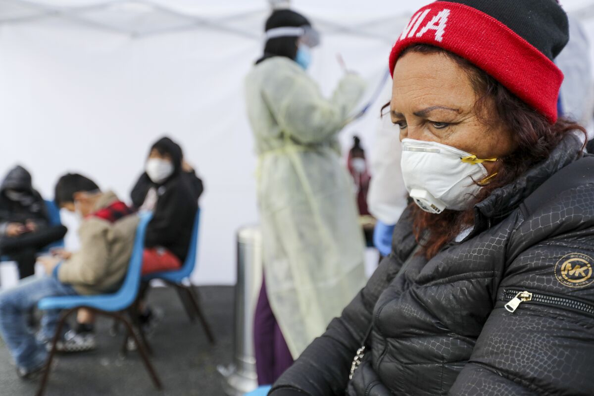 Ada Gomez, 59, suffering from low fever, cough and sore throat, at COVID-19 screening station set-up in Watts Health Center, Los Angeles.