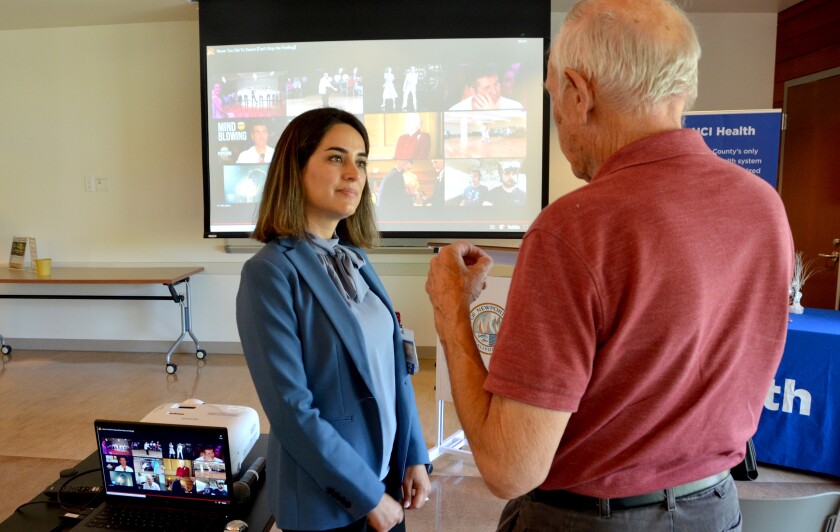 Dr. Elham Arghami answers an attendee's questions following the UCI Health lecture on at OASIS Senior Center in June.
