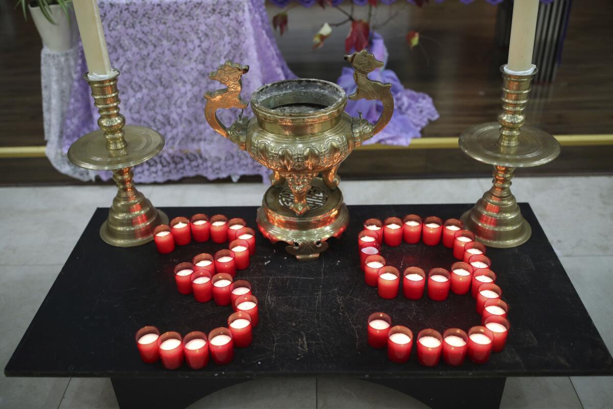 Candles are arranged at a Vietnamese church in London on Saturday during a service and vigil to honor the 39 victims who died in a refrigerated truck container last month.