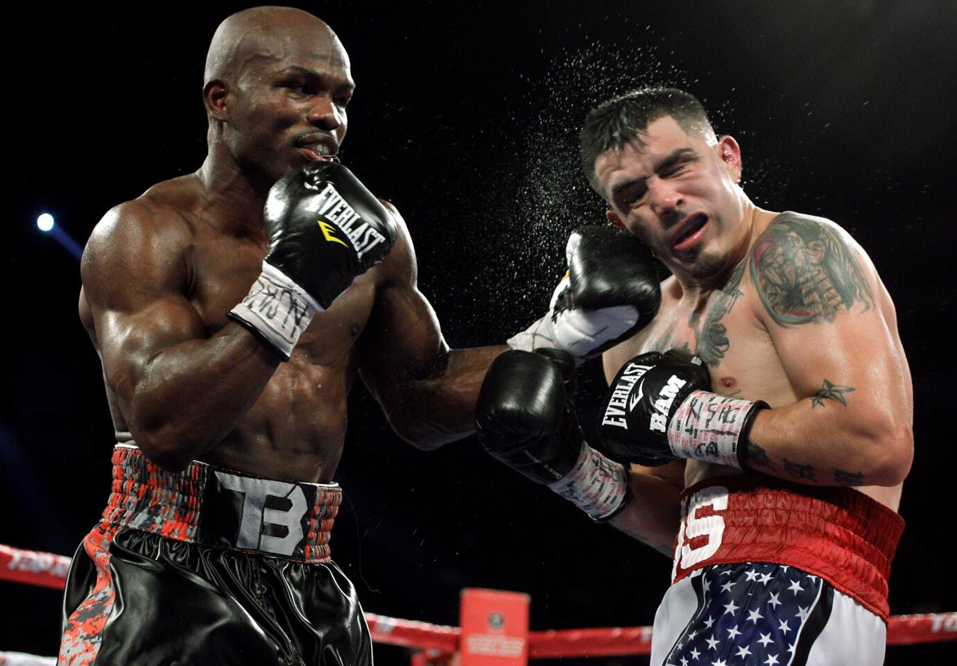 Champion Timothy Bradley (L) connects with a left against challenger Brandon Rios (R) at the Thomas & Mack Center in Las Vegas, Nevada. Bradley retained his welterweight title by technical knockout at 2:49 of the ninth round.