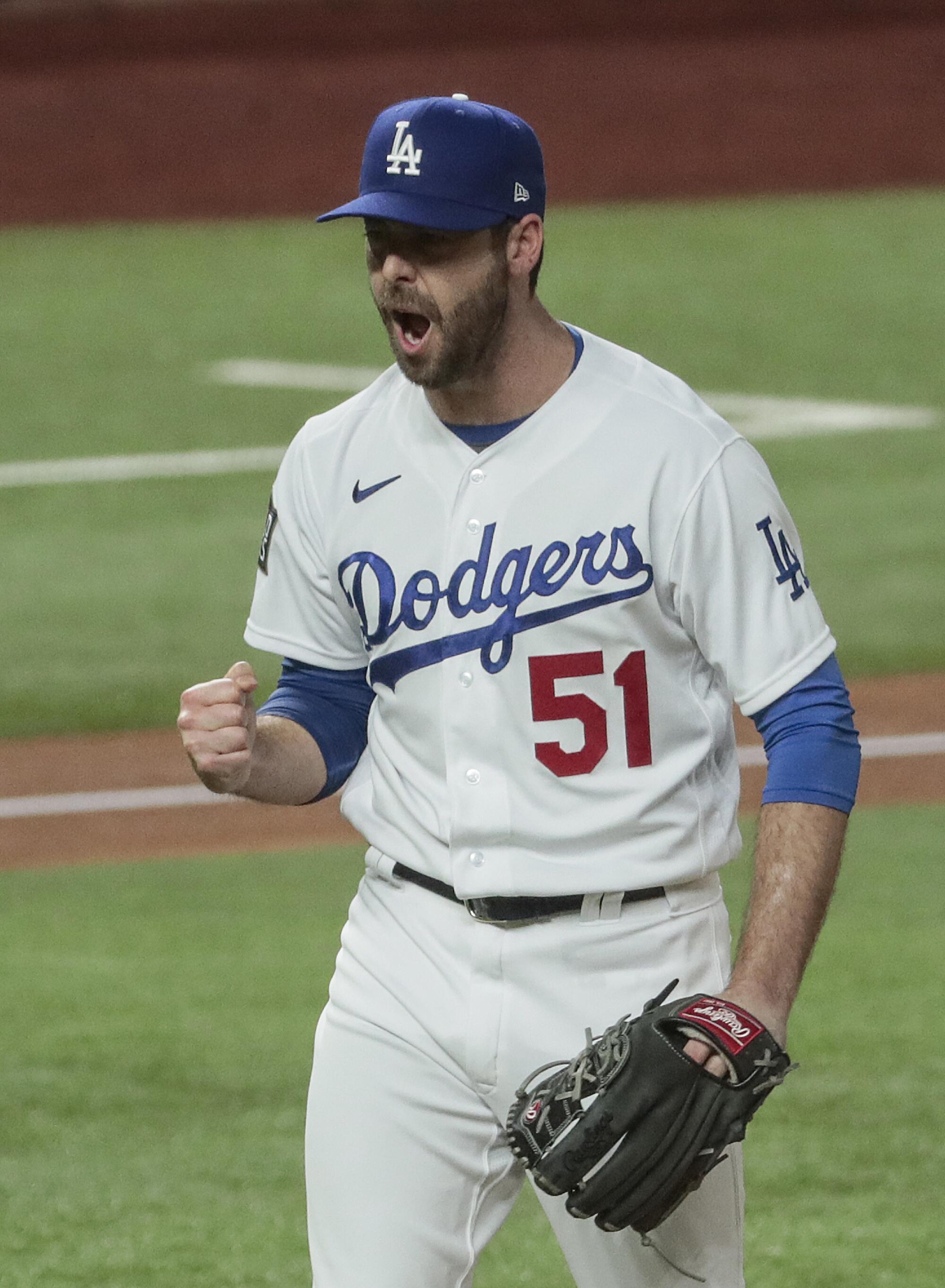 Dodgers relief pitcher Dylan Floro clenches a fist after striking out Randy Arozarena.