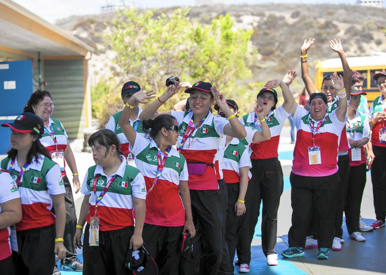 A group of Special Olympians from Mexico cheers after arriving at the Back Bay Science Center on Wednesday.