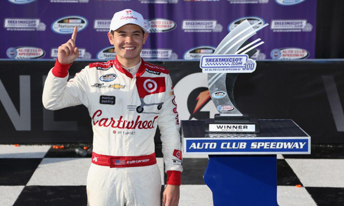 Kyle Larson celebrates after winning Saturday's NASCAR Nationwide Series race at Auto Club Speedway in Fontana.