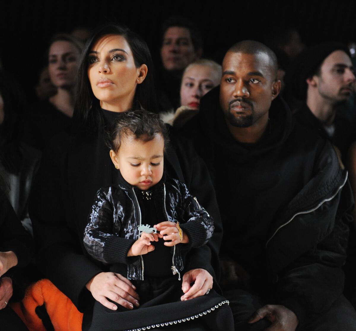 Kim Kardashian, North West and Kanye West attend the Alexander Wang fashion show at Pier 94 on Feb. 14 during New York Fashion Week.