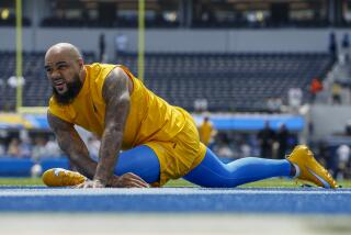 Chargers receiver Keenan Allen stretches before a game.