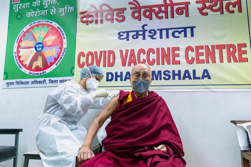 This photograph provided by Office of his Holiness the Dalai Lama shows the Tibetan spiritual leader receiving a shot of the COVID-19 vaccine at Zonal Hospital in Dharmsala, India, Saturday, March 6, 2021. (Office of the his holiness the Dalai Lama via AP)