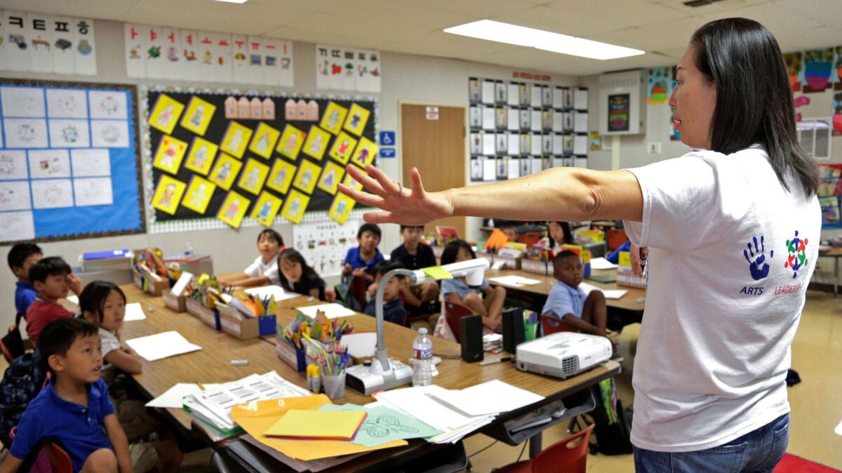 Regina Yang leads a bilingual Korean-English language immersion classes at Porter Ranch Community School in Los Angeles. California voters will consider a ballot measure that will allow expanded use of other languages than English in the classroom.