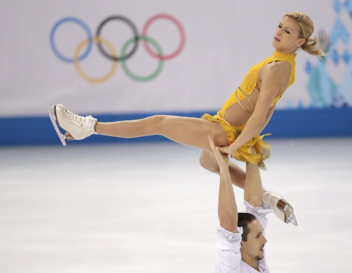 Tatiana Volosozhar and Maxim Trankov of Russia compete in the pairs free skate competition at the 2014 Winter Olympics in Sochi, Russia.
