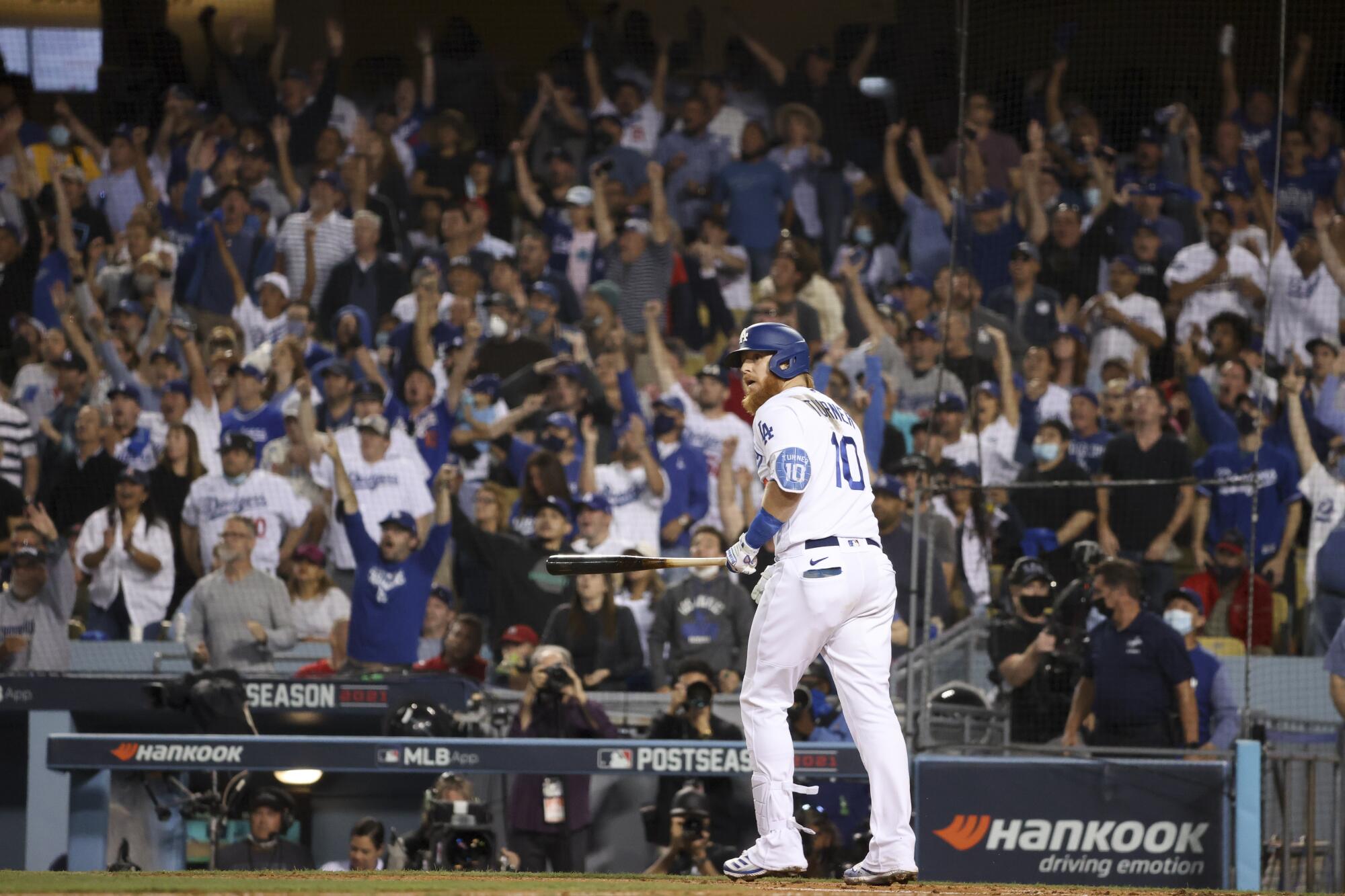 Los Angeles Dodgers' Justin Turner looks up after hitting a solo home run to tie the game