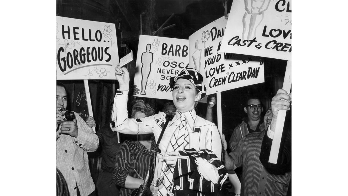 April 15, 1969: Workers at Paramount Pictures greet Barbra Streisand with congratulatory signs as she reports to work on the set of "On a Clear Day You Can See Forever."