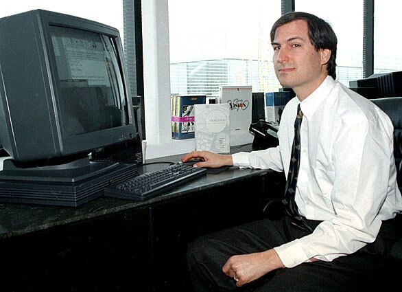 Jobs shows off his NeXTstation color computer at his company's Redwood City, Calif., facility in 1991. The same year, he and his wife, Laurene Powell, were married at Yosemite National Park by a Buddhist monk.
