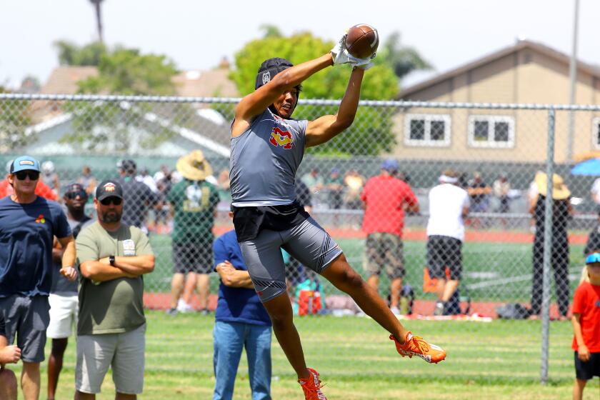 Mikey Matthews leaps to try to make a catch during the Battle at the Beach seven-on-seven passing tournament July 9, 2022.