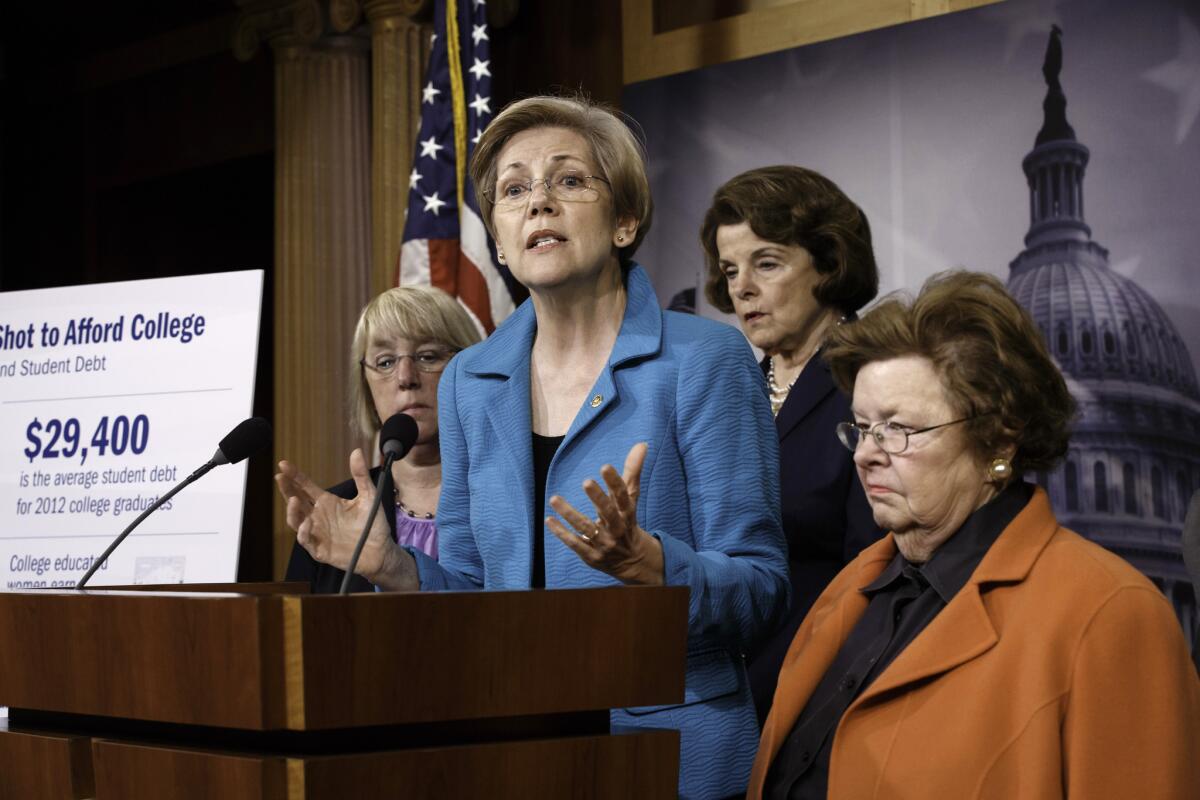 Sen. Elizabeth Warren, center, holds a news conference on her bill, the Bank on Students Emergency Loan Refinancing Act, that would allow people with outstanding student loan debt to refinance at the lower interest rates currently offered to new borrowers.