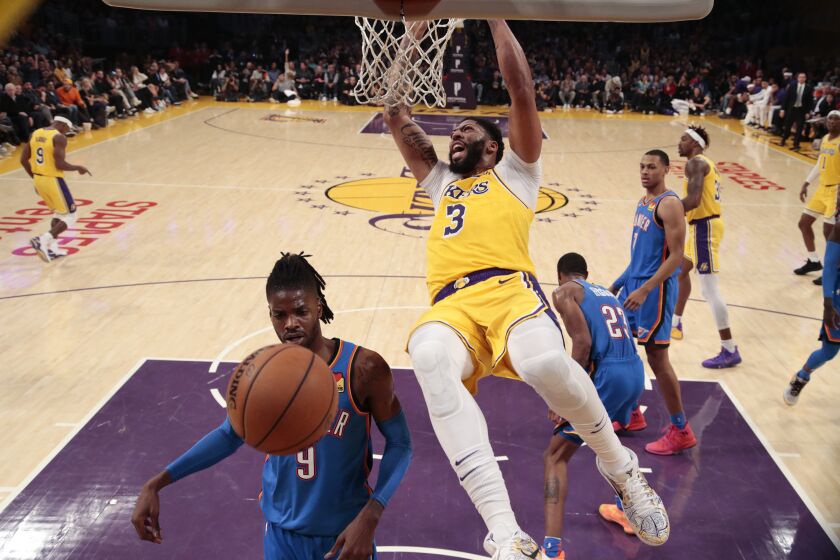 LOS ANGELES, CA, TUESDAY, NOVEMBER 19 2019 - Los Angeles Lakers forward Anthony Davis (3) slams over Oklahoma City Thunder center Nerlens Noel (9) during second half action at Staples Center. (Robert Gauthier/Los Angeles Times)