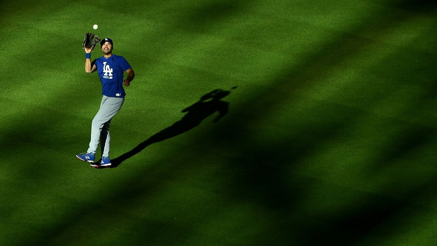 Andre Ethier of the Dodgers fields a fly ball during batting practice.