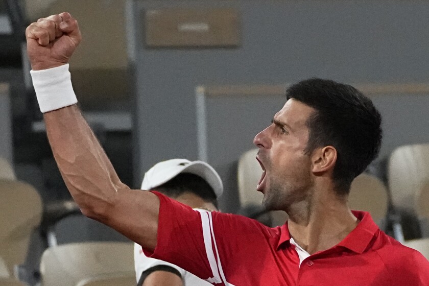 Serbia's Novak Djokovic reacts as he defeats Italy's Matteo Berrettini in a quarterfinal match of the French Open tennis tournament at the Roland Garros stadium Wednesday, June 9, 2021 in Paris. (AP Photo/Michel Euler)