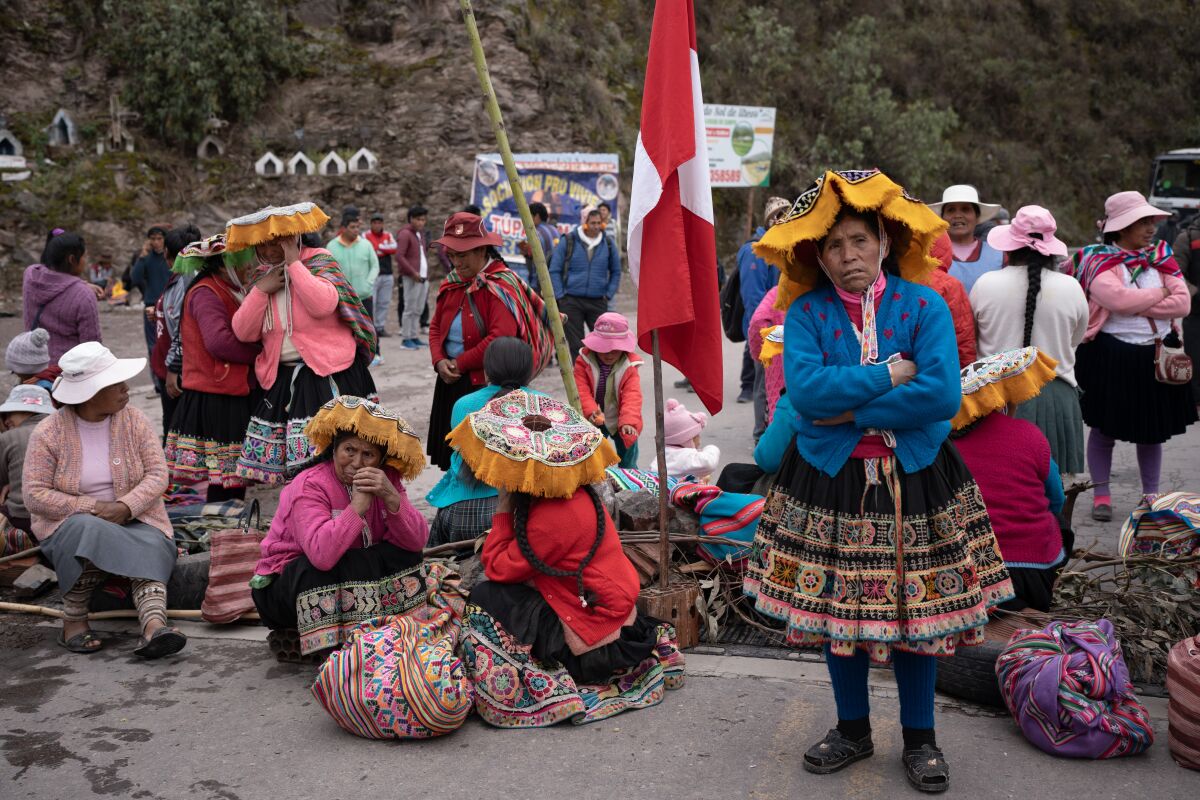 Villagers block a bridge during antigovernment protests in rural Peru.