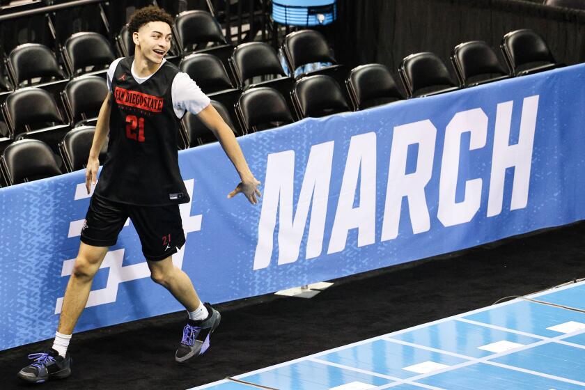 Spokane, WA - March 21: San Diego State guard Miles Byrd (21) smiles after a 3-pointer during a practice ahead of the Aztecs first round NCAA tournament game against UAB at Spokane Arena on Thursday, March 21, 2024 in Spokane, WA.(Meg McLaughlin / The San Diego Union-Tribune)