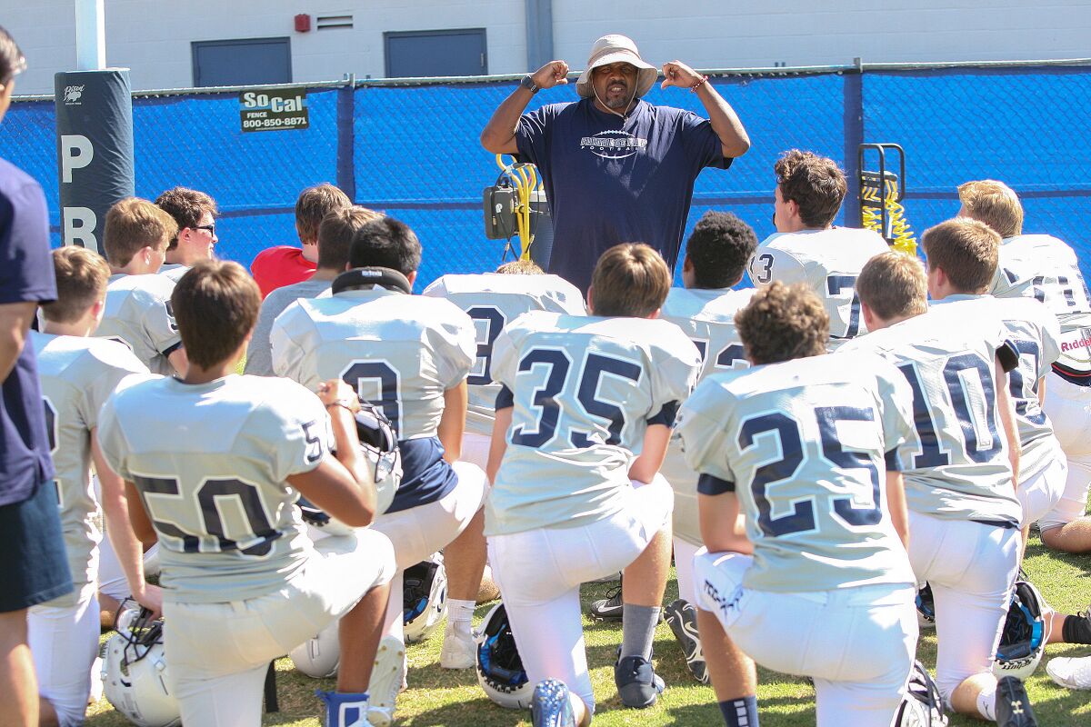 Flintridge Prep football coach Russell White talks about the importance of the commitment to the Rebels during a recent preseason practice.