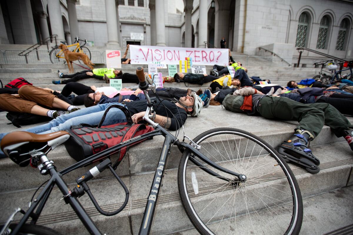 Pedestrian and cyclist advocates at City Hall in 2019 protest Los Angeles' lack of progress in reducing traffic deaths.