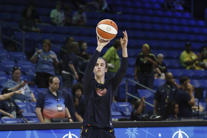 Indiana Fever guard Caitlyn Clark warms up prior to an WNBA basketball game against the Dallas Wings in Arlington, Texas, Friday, May 3, 2024. (AP Photo/Michael Ainsworth)