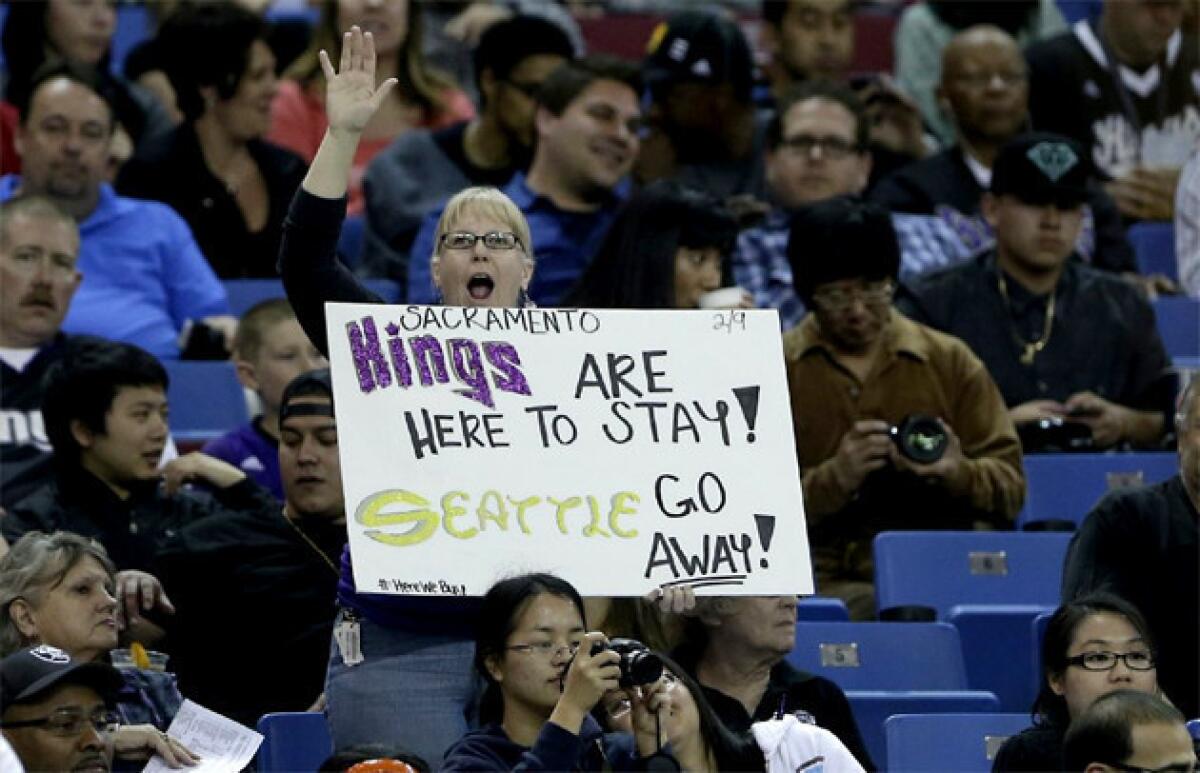 A Sacramento Kings fan shows her support to keep the team in Sacramento.