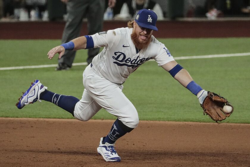 Arlington, Texas, Tuesday, October 20, 2020 Los Angeles Dodgers third baseman Justin Turner (10) snags a grounder hit by Tampa Bay Rays first baseman Yandy Diaz (2) for the first out in the sixth inning in game one of the World Series at Globe Life Field. (Robert Gauthier/ Los Angeles Times)