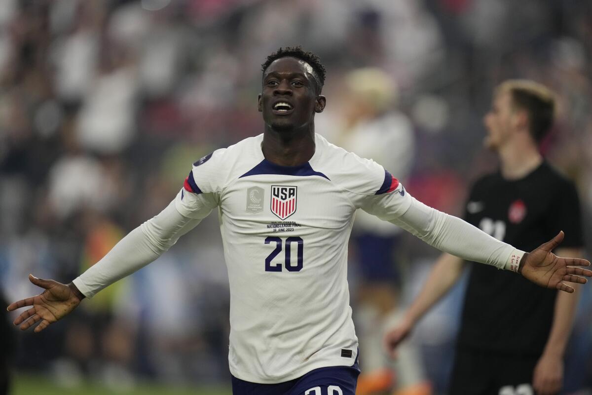 U.S. striker Folarin Balogun celebrates after scoring against Canada in the first half Sunday.