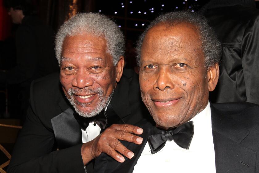 Morgan Freeman and Sidney Poitier pose at an awards event
