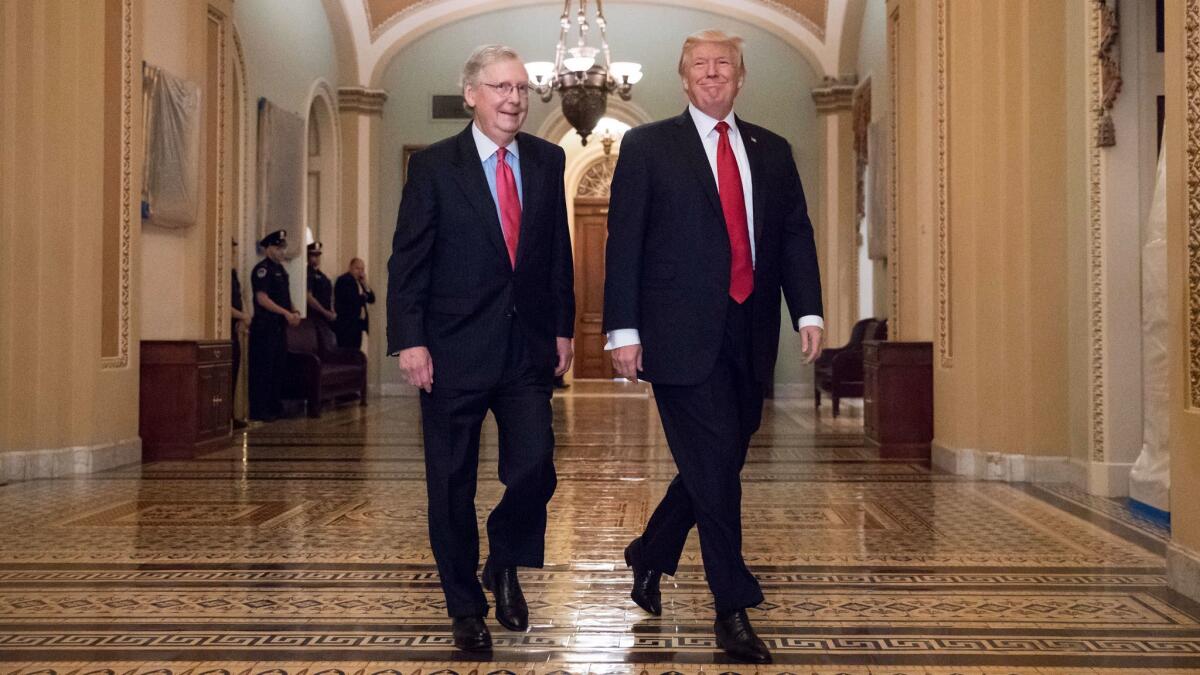 President Donald Trump and Senate Majority Leader Mitch McConnell walk to a tax reform lunch meeting on Oct. 24.
