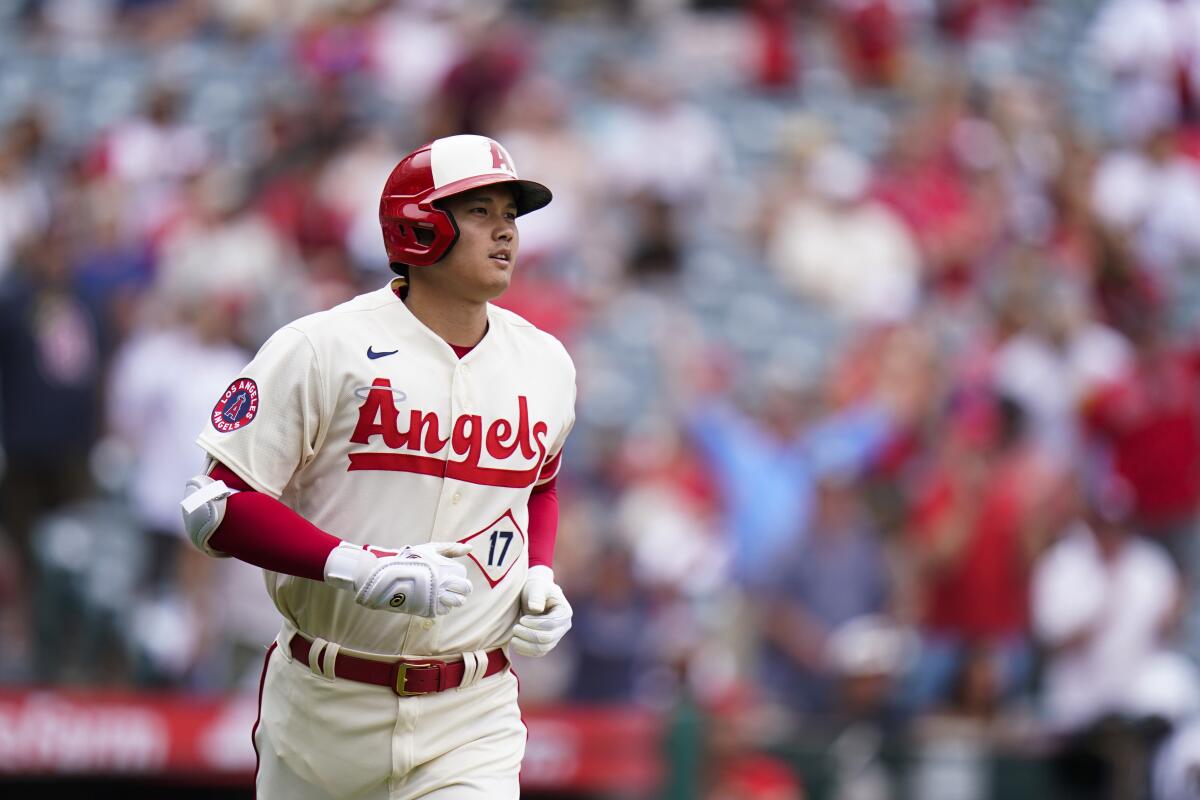 Angels' Shohei Ohtani runs the bases after hitting a home run.
