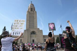 FILE - Protesters line the street around the front of the Nebraska State Capitol during an Abortion Rights Rally held on July 4, 2022, in Lincoln, Neb. A petition referendum effort is being launched to establish abortion rights in Nebraska, following on the heels of similar successful efforts in other reds states. Documents released by the Nebraska Secretary of State's office Wednesday, Nov. 15, 2023 show that a coalition of civil rights and advocacy groups is leading the effort to enshrine abortion rights within the Nebraska Constitution. (Kenneth Ferriera/Lincoln Journal Star via AP, File)