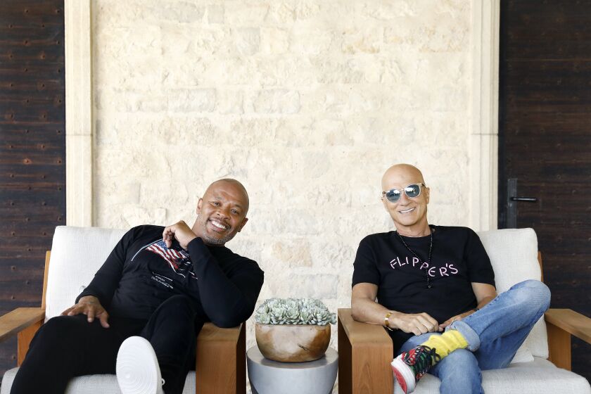 LOS ANGELES-CA-JUNE 11, 2021: Dr. Dre, left, and Jimmy Iovine, both music moguls from humble roots, are photographed at Dr. Dre's home in Los Angeles on Friday, June 11, 2021. The two are launching a new public high school in South L.A. to open in Fall 2022. It will be a magnet high school, under the jurisdiction of L.A. Unified and housed at Audubon Middle School in Leimert Park. Students from across the district can apply but the program will be particularly targeted for the South L.A. area. (Christina House / Los Angeles Times)