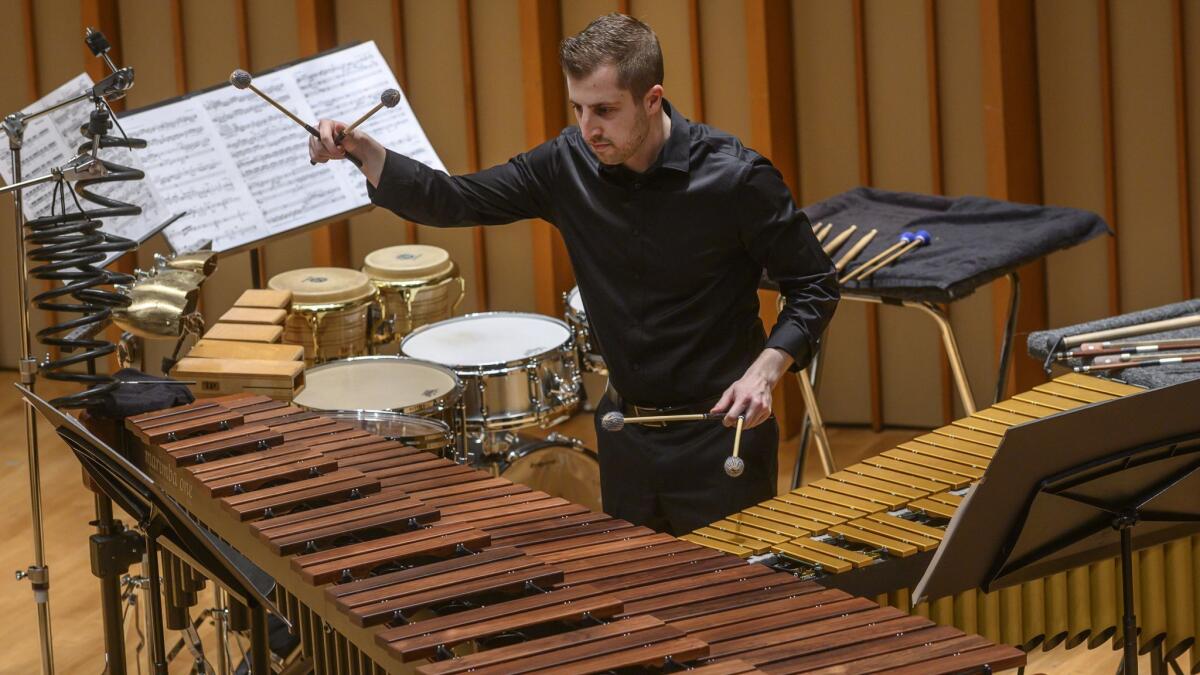Last-minute substitute Jeff Grant performs William Kraft's Concerto for Percussion and Chamber Ensemble with TM+ during the Hear Now music festival on Friday at Zipper Concert Hall.